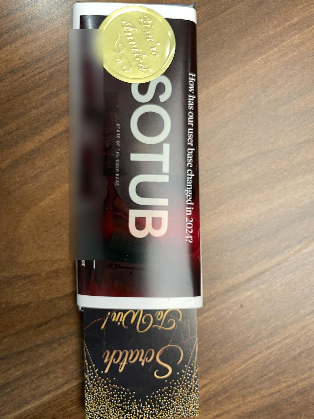 A custom SOTUB chocolate bar with a golden You're Invited seal